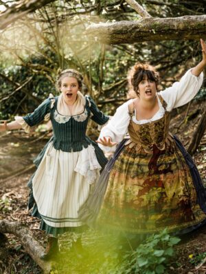 The Grimm sister frolic in the woods.