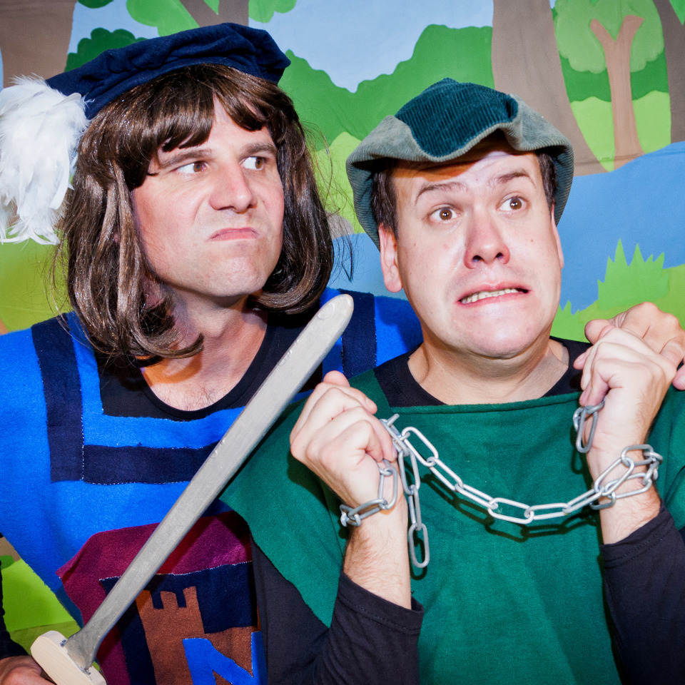 Two actors posing in typical Robin Hood costumes.